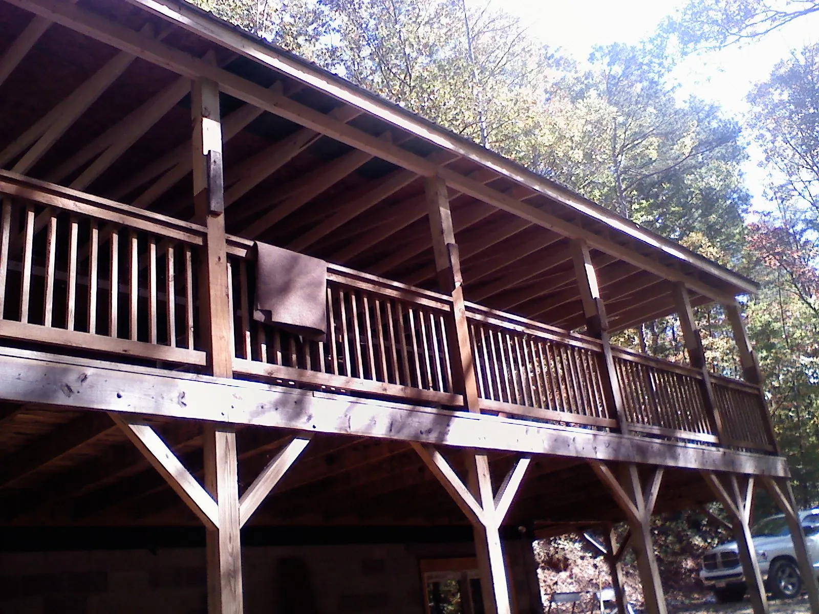 Timber framing under a new elevated porch and deck — Roof Leak Repair in Thetford Center by Roofing Brothers